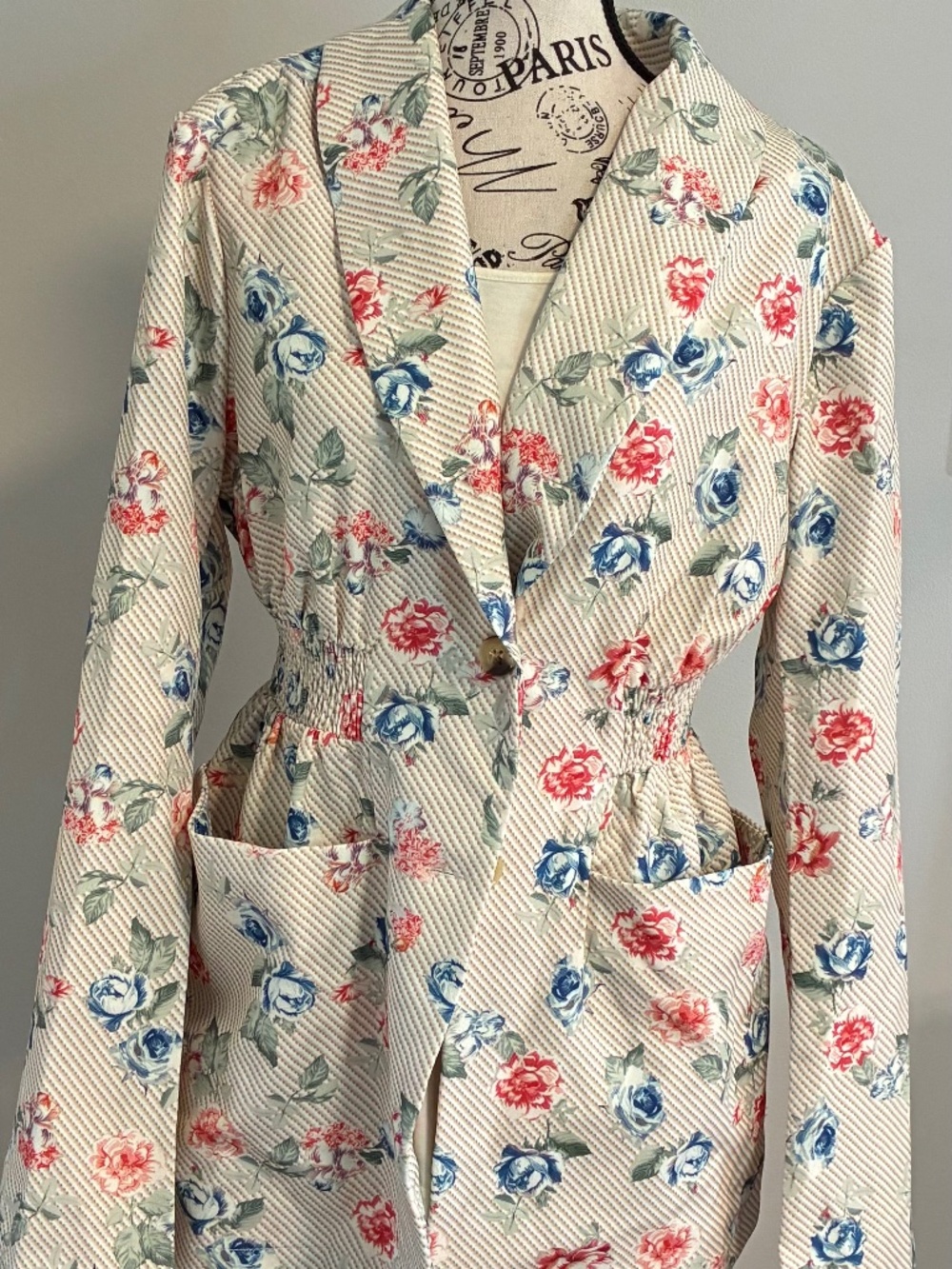 NWOT Cute floral print button up jacket with elastic waist. Size M. Brand new.